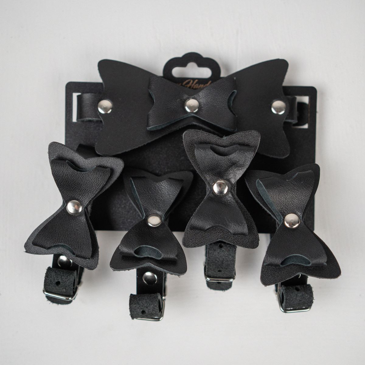 Набор фиксаций с бантиками из черной натуральной кожи 1